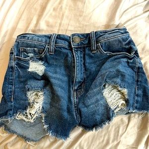 High wasted jean shorts cut off ropes at the bottom